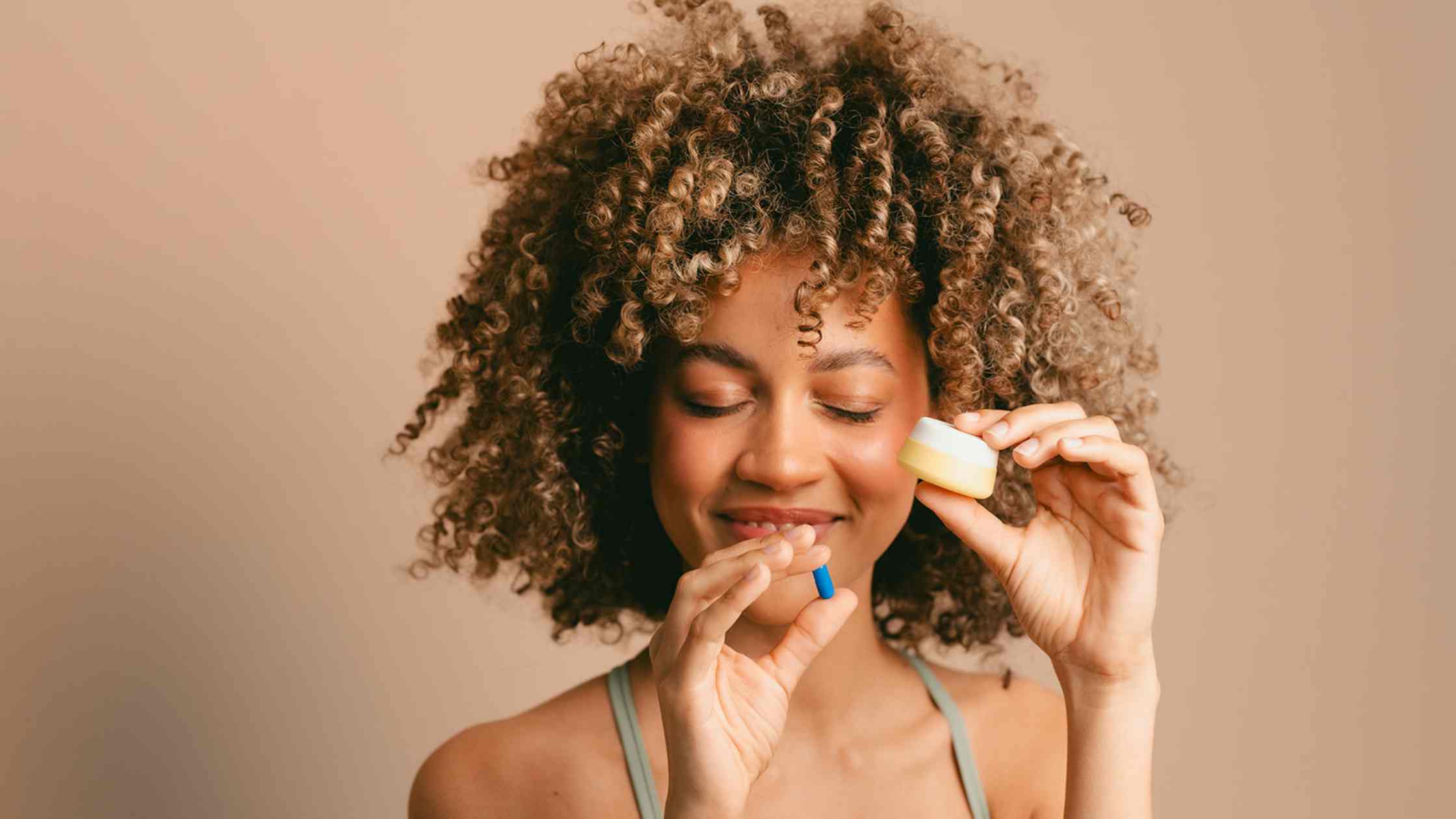Women Smiling with Silicone Jar for Medication Management
